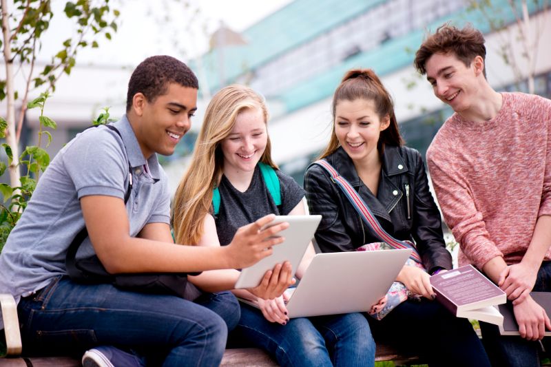 students sitting together smiling